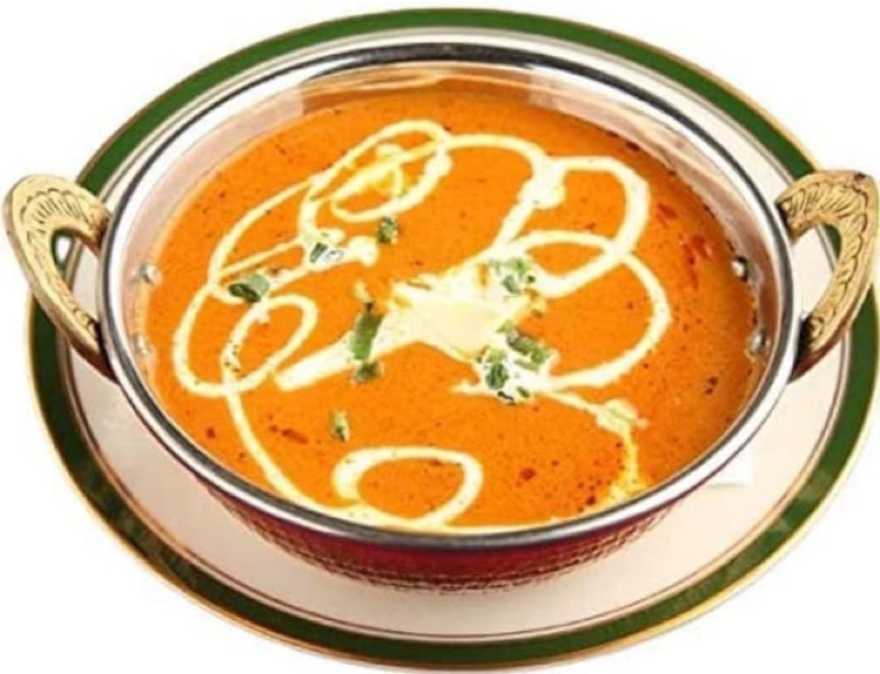 Butter chicken served in traditional bowl